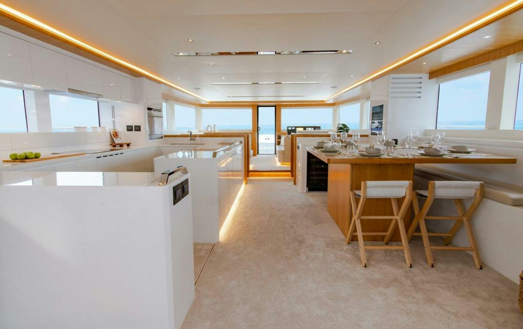 a kitchen with a table and chairs aboard NONE Yacht for Sale