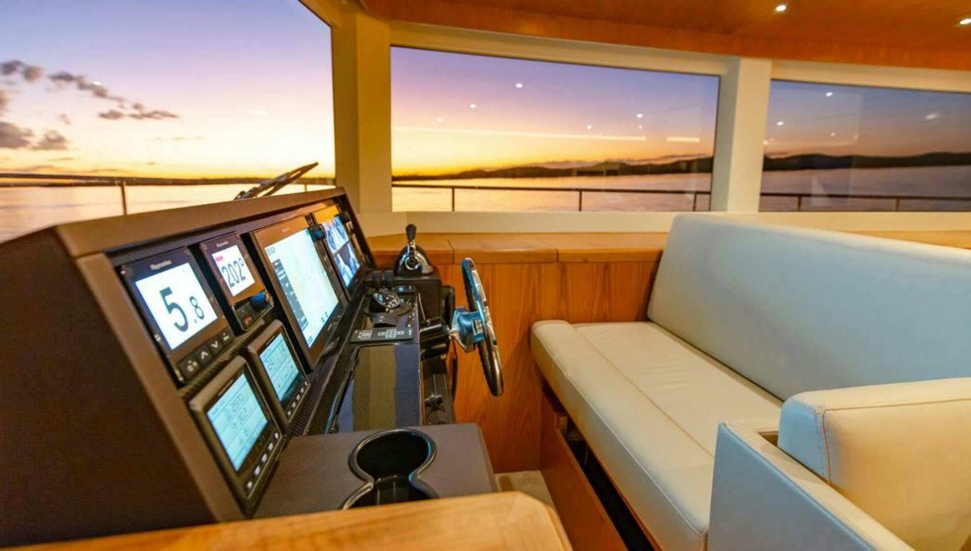 a room with a couch and a television aboard NONE Yacht for Sale