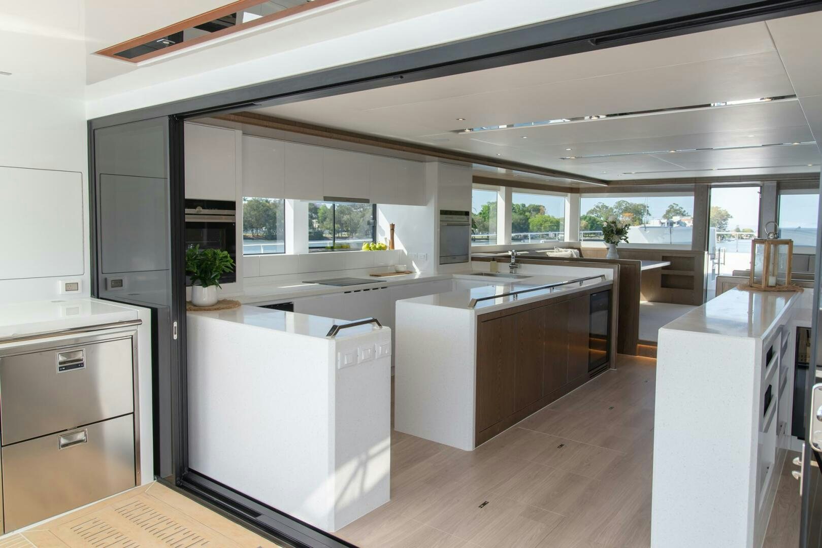 a kitchen with white cabinets aboard NONE Yacht for Sale