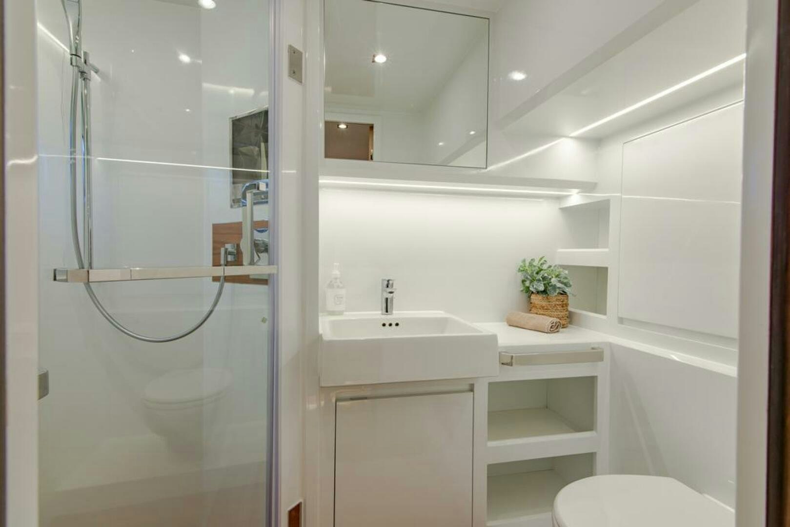 a bathroom with a glass shower aboard NONE Yacht for Sale
