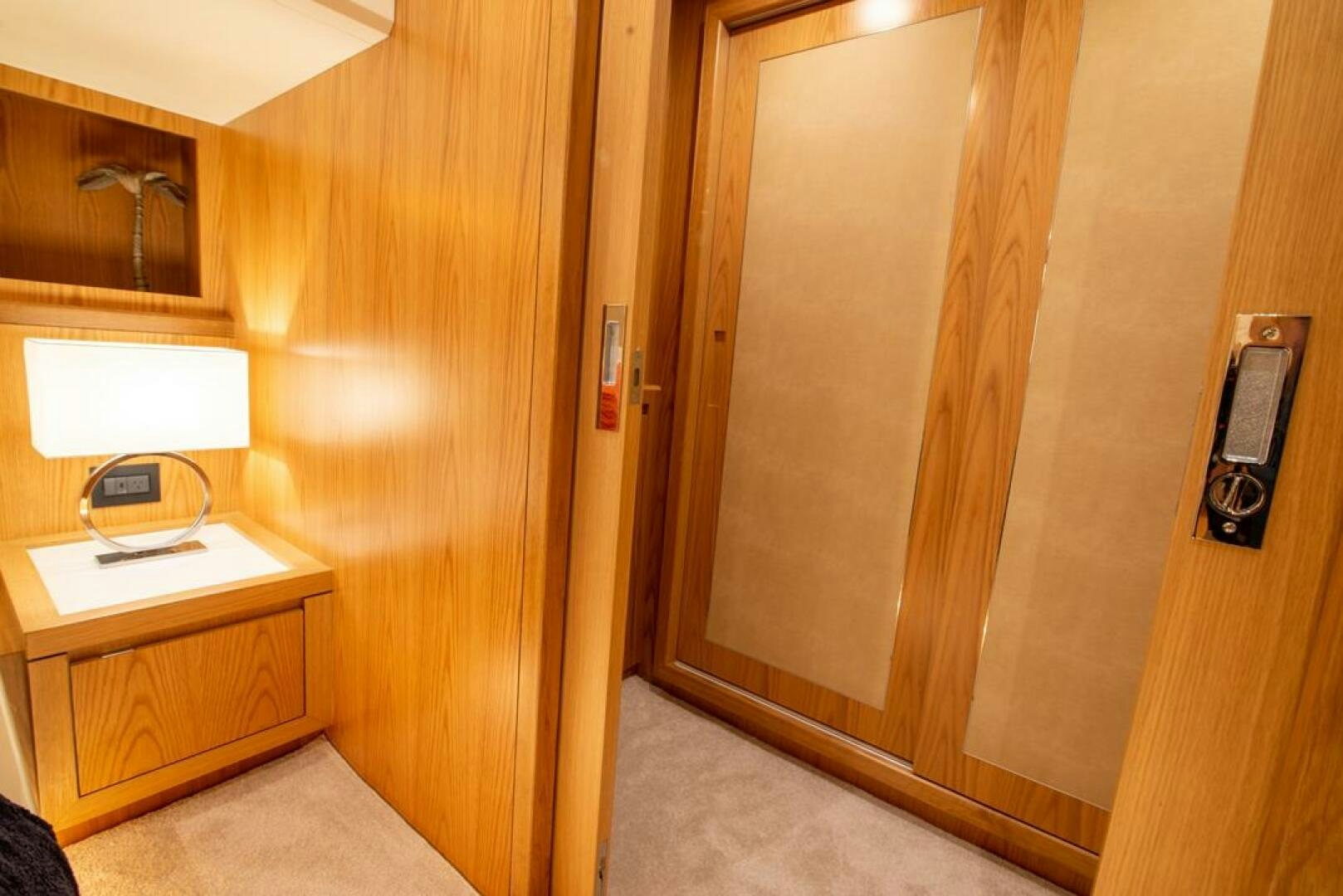 a wooden closet with a light aboard NONE Yacht for Sale