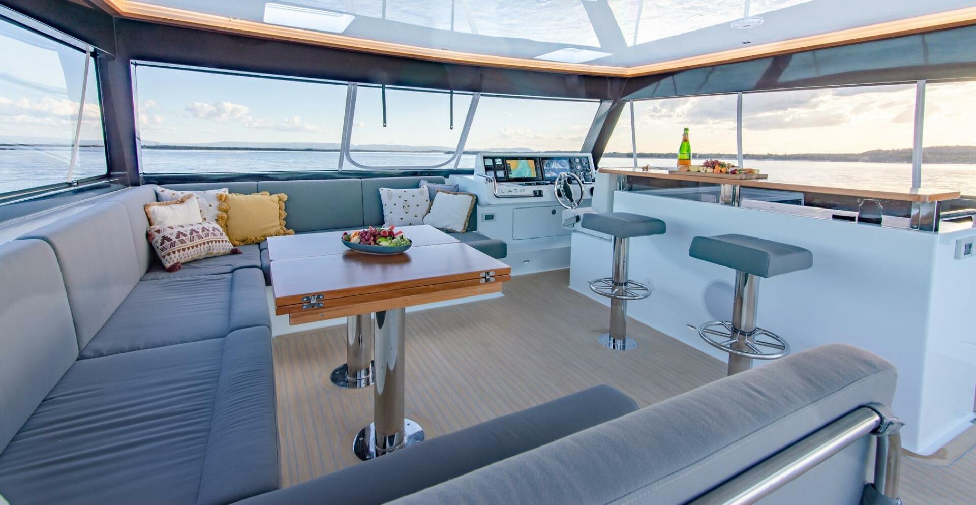 a room with a couch and a table aboard NONE Yacht for Sale