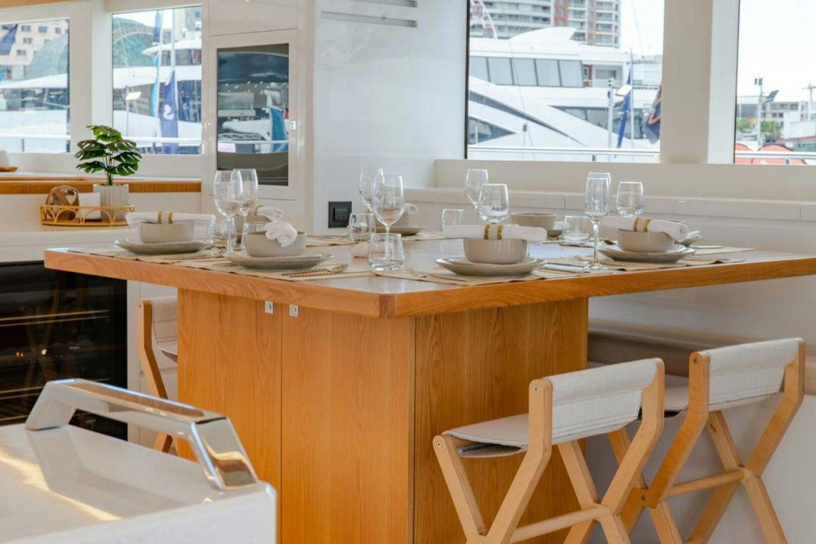 a table with plates and glasses on it aboard NONE Yacht for Sale