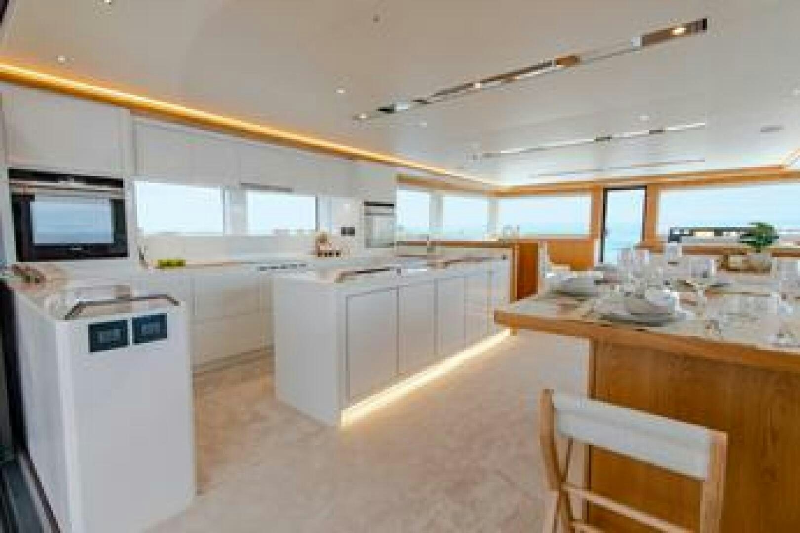 a kitchen with white cabinets aboard NONE Yacht for Sale