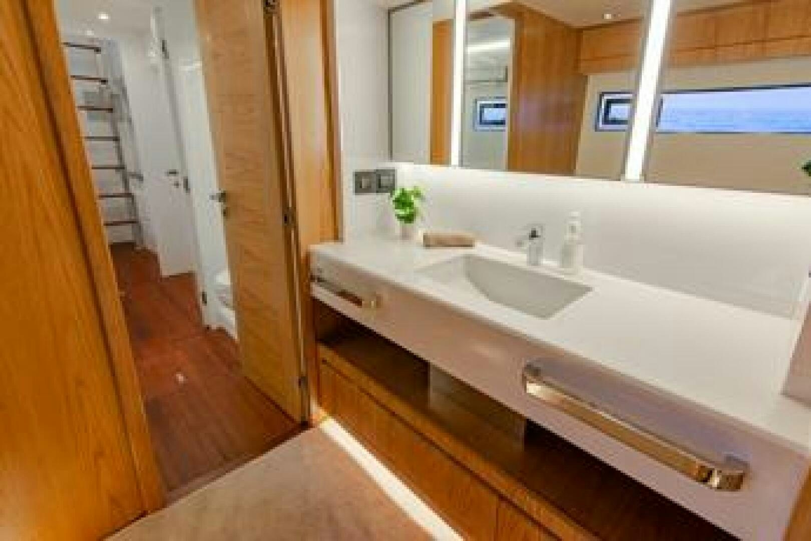 a bathroom with a sink and a mirror aboard NONE Yacht for Sale