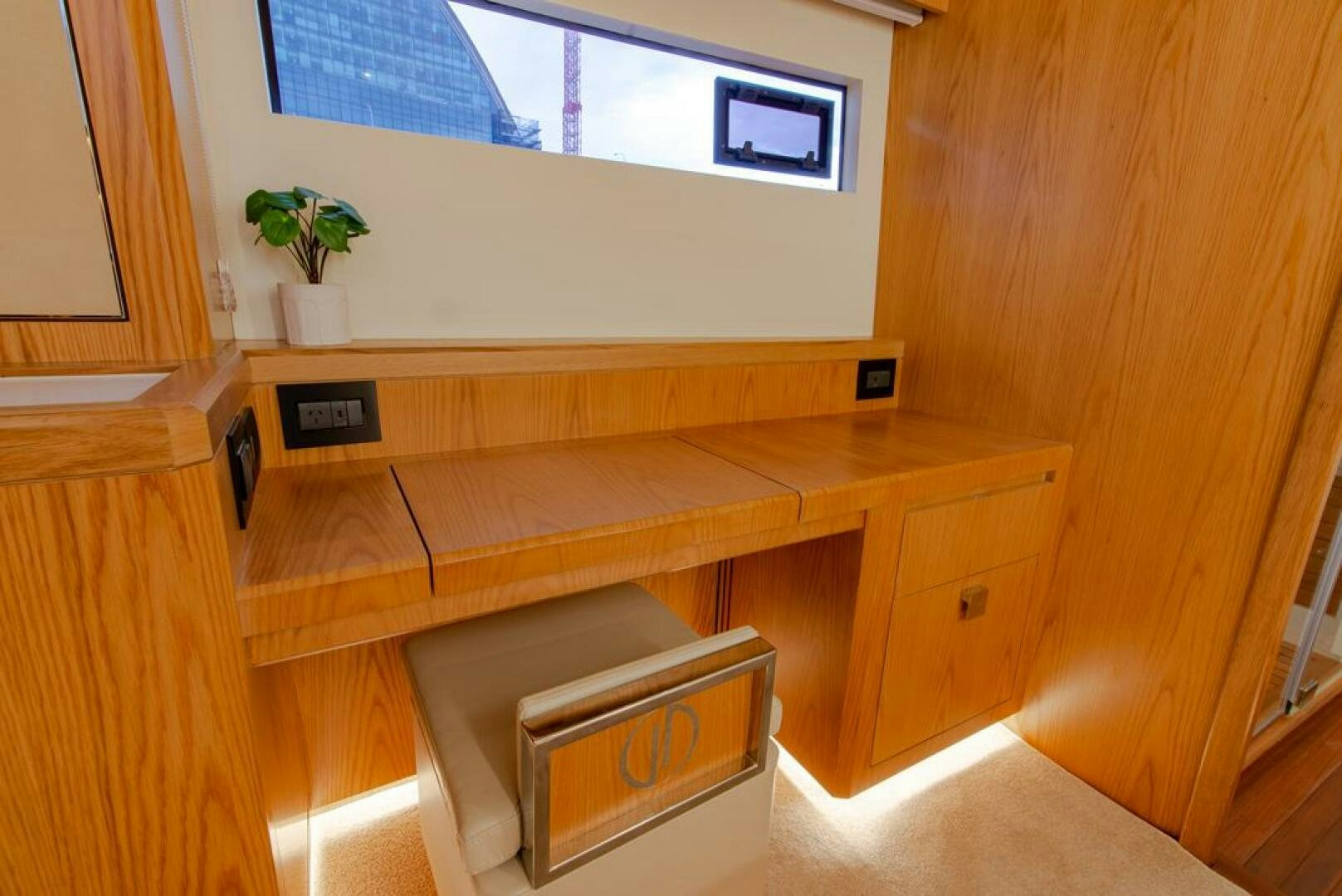 a room with a desk and a window aboard NONE Yacht for Sale