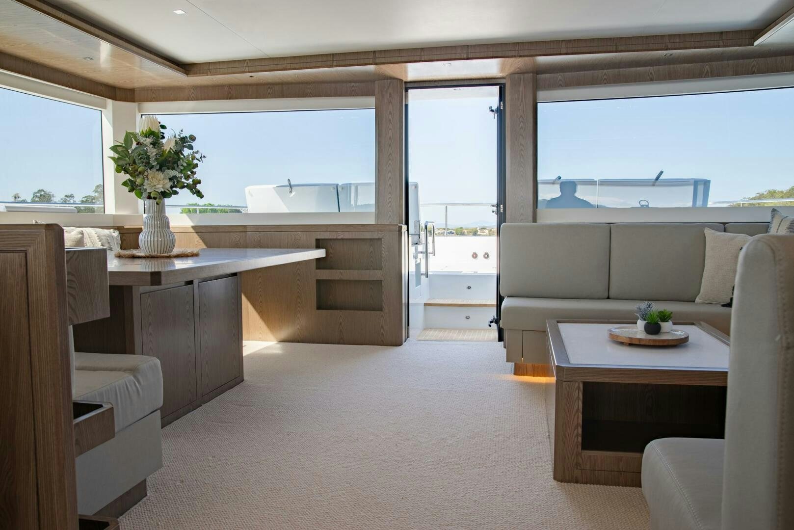 a living room with a table and chairs aboard NONE Yacht for Sale