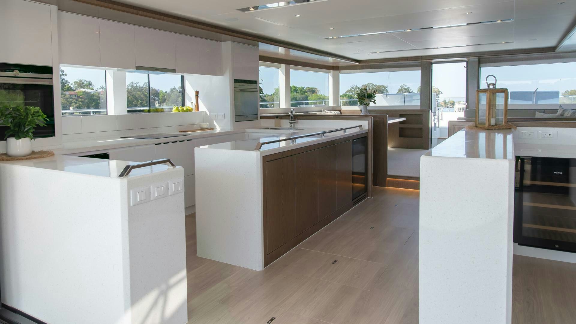 a kitchen with white cabinets aboard NONE Yacht for Sale
