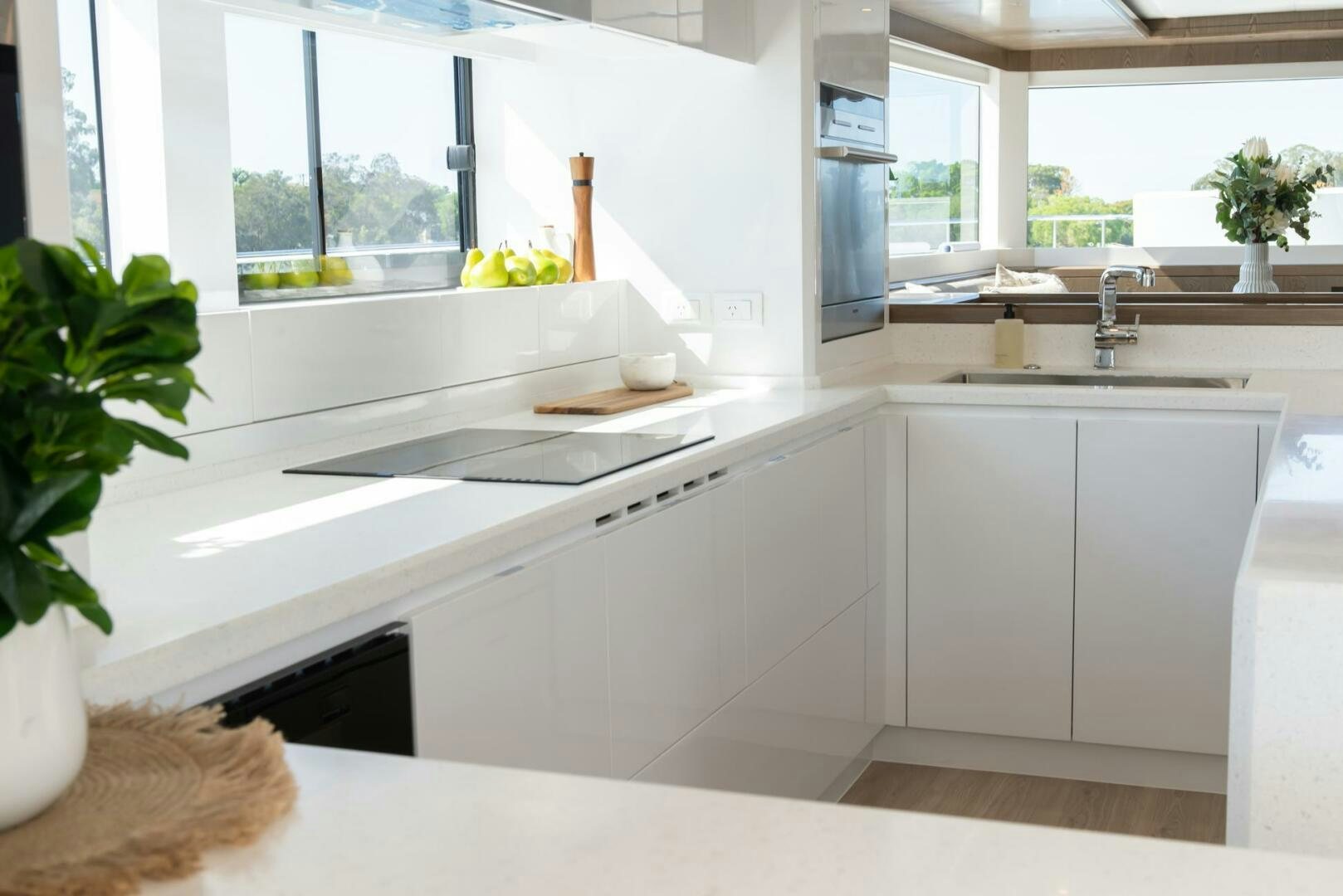 a kitchen with white cabinets aboard NONE Yacht for Sale