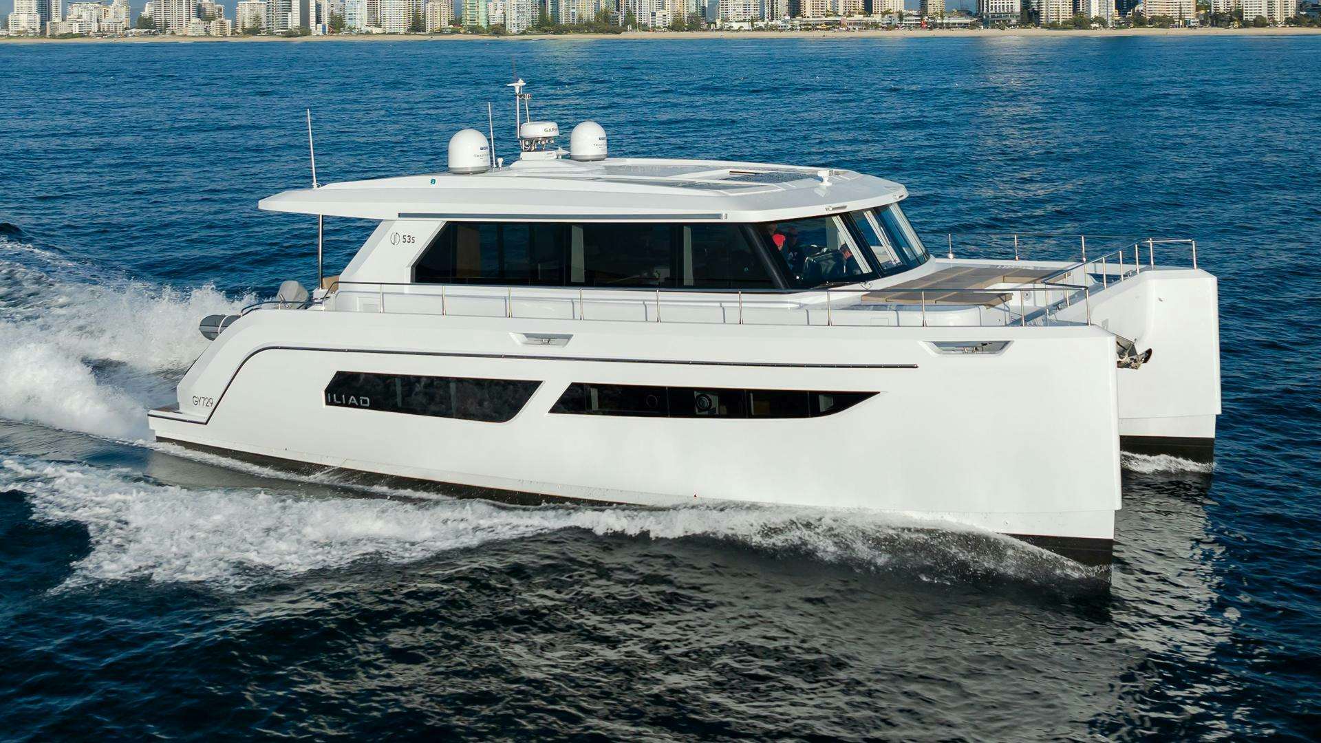 a white yacht on the water aboard ILIAD 53F Yacht for Sale