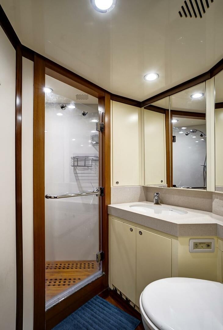 a bathroom with a shower unit and sink aboard SWEET CAROLINE Yacht for Sale