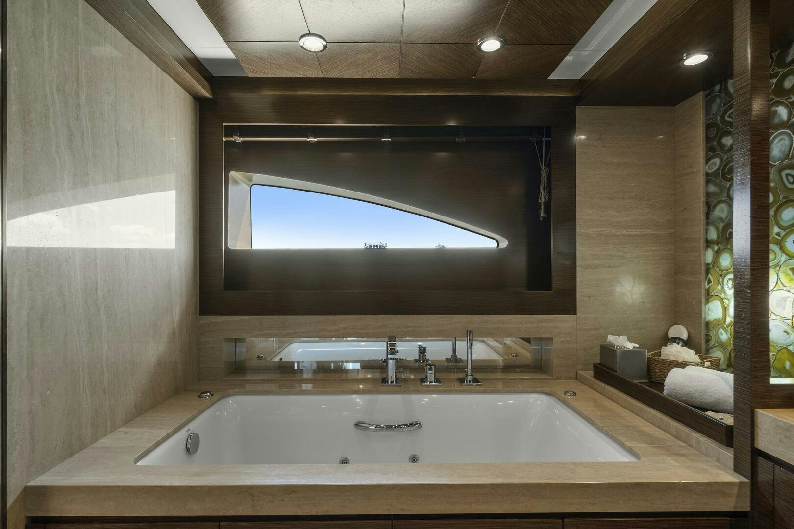 a bathroom with a large mirror aboard SWEET CAROLINE Yacht for Sale