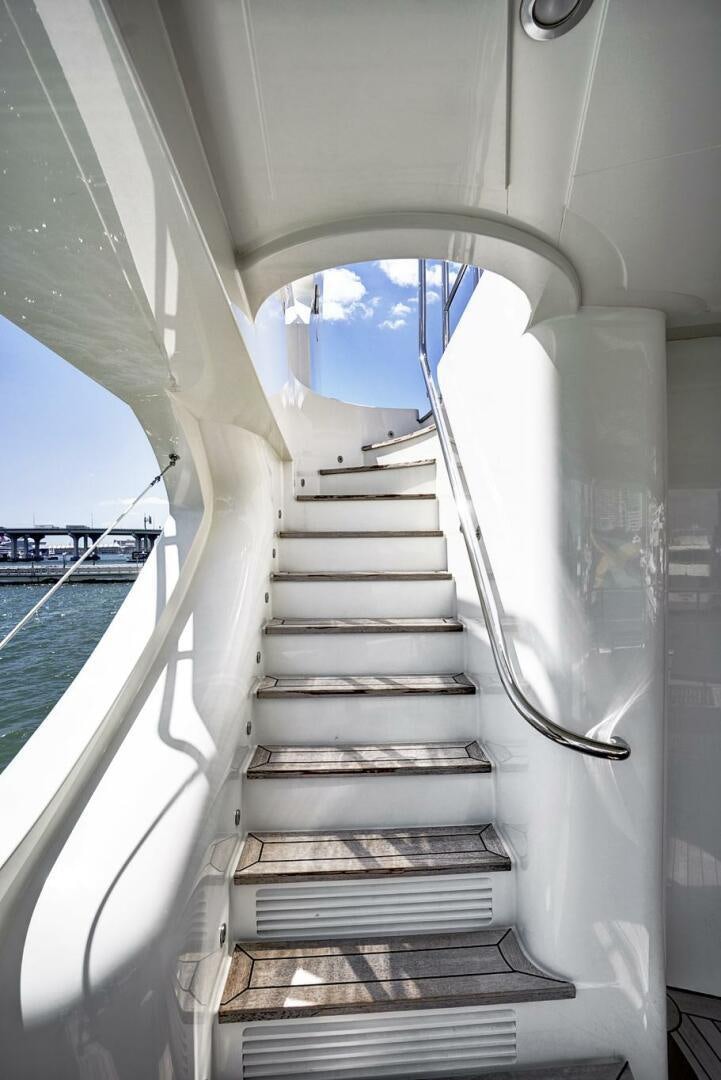 a white staircase with a railing aboard SWEET CAROLINE Yacht for Sale