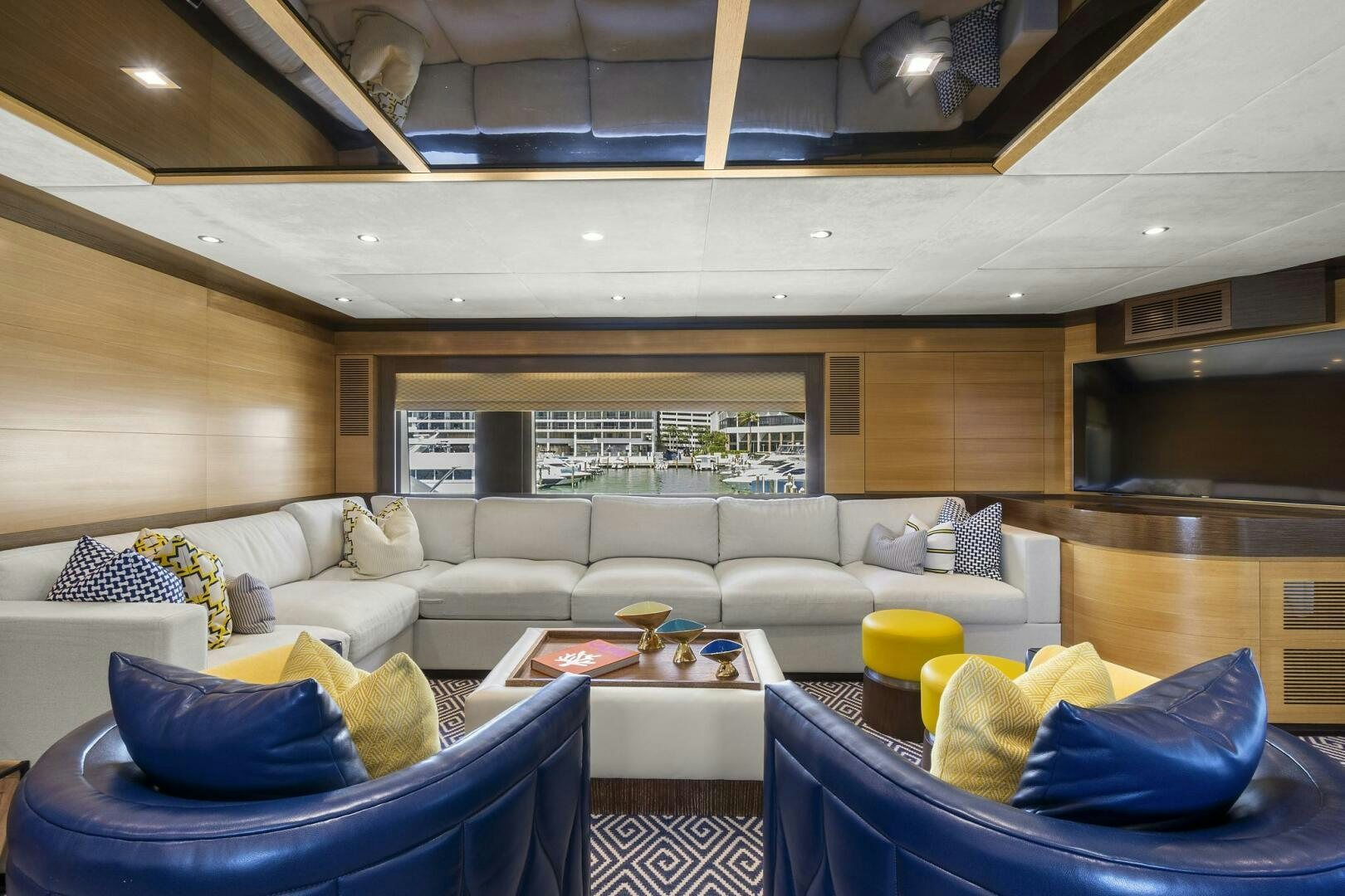 a living room with a couch and a table aboard SWEET CAROLINE Yacht for Sale
