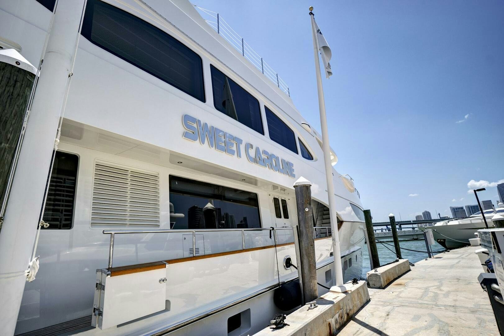 a white building with a blue sign aboard SWEET CAROLINE Yacht for Sale