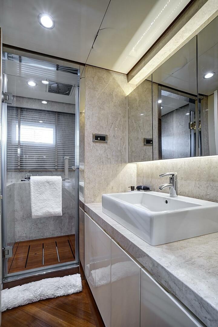 a bathroom with a glass shower aboard SWEET CAROLINE Yacht for Sale