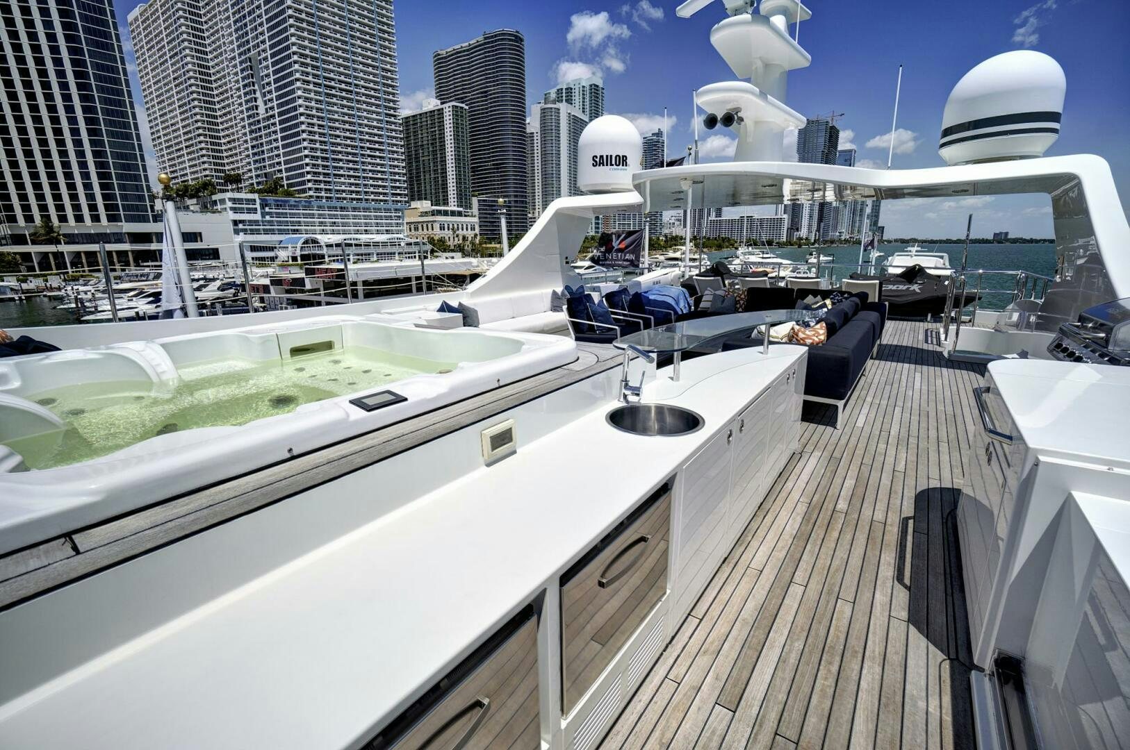 a deck with a large white boat and a large white building with a white dome and a white aboard SWEET CAROLINE Yacht for Sale
