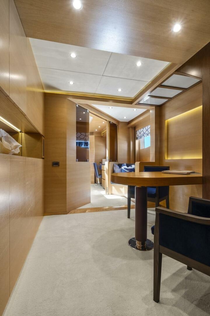 a room with a table and chairs aboard SWEET CAROLINE Yacht for Sale