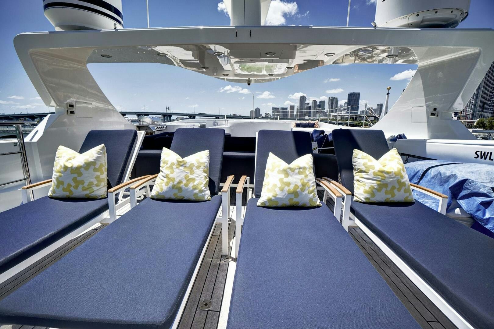 a boat with a city in the background aboard SWEET CAROLINE Yacht for Sale