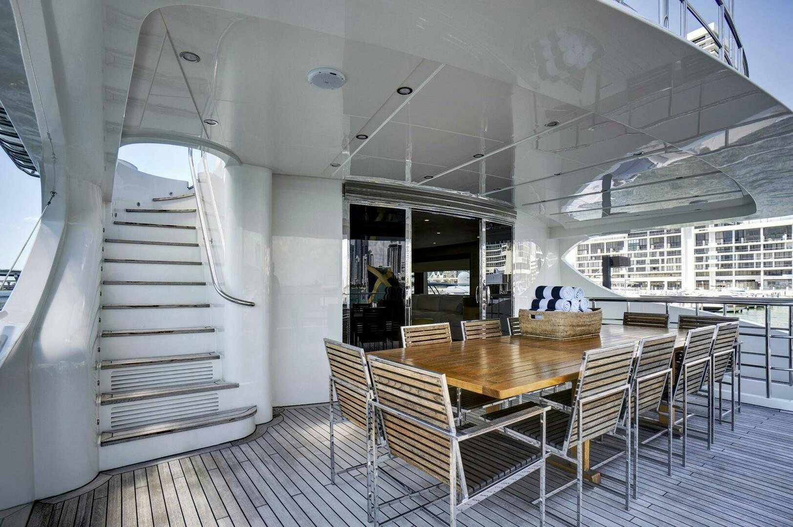 a room with tables and chairs aboard SWEET CAROLINE Yacht for Sale
