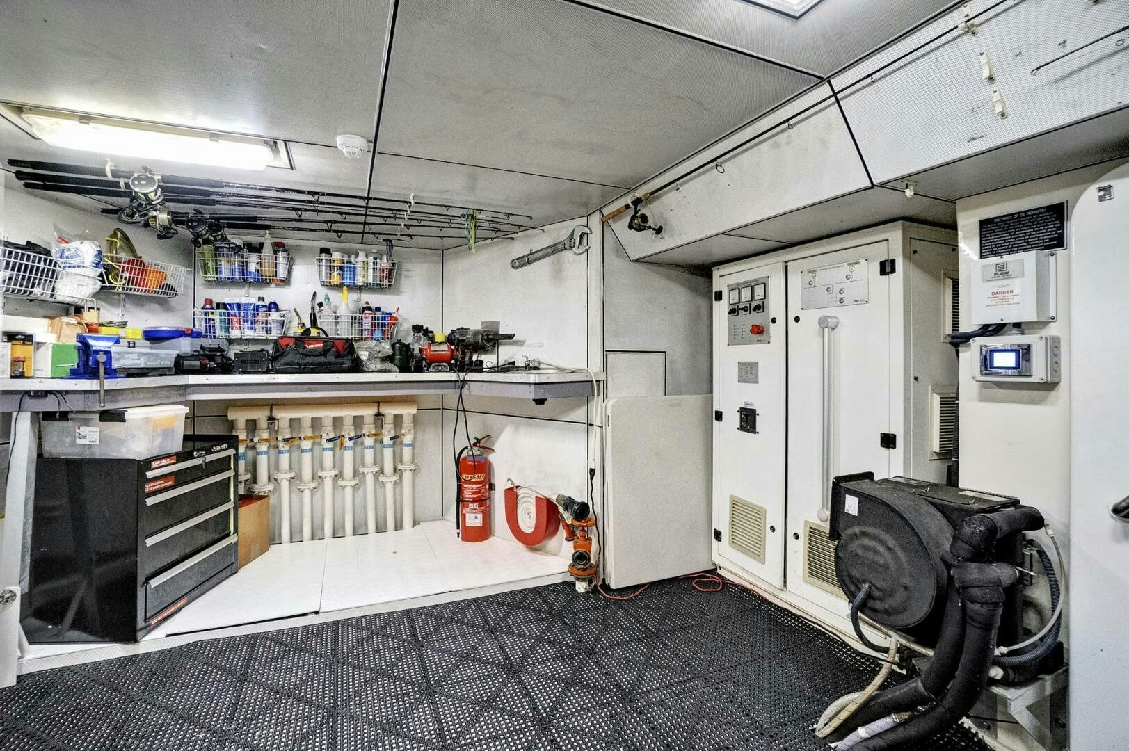 a room with equipment and shelves aboard SWEET CAROLINE Yacht for Sale
