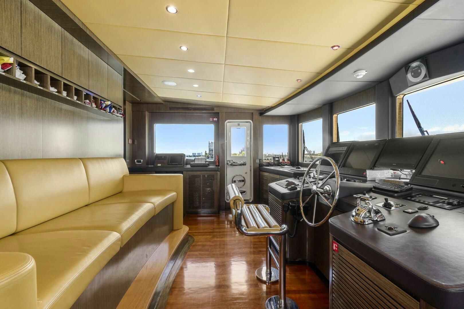 a living room with a large window aboard SWEET CAROLINE Yacht for Sale