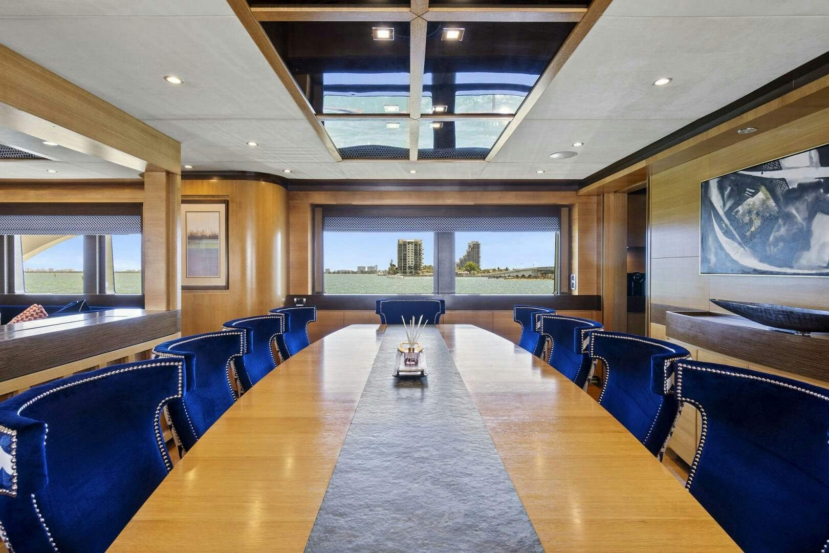 a large conference room with a table aboard SWEET CAROLINE Yacht for Sale