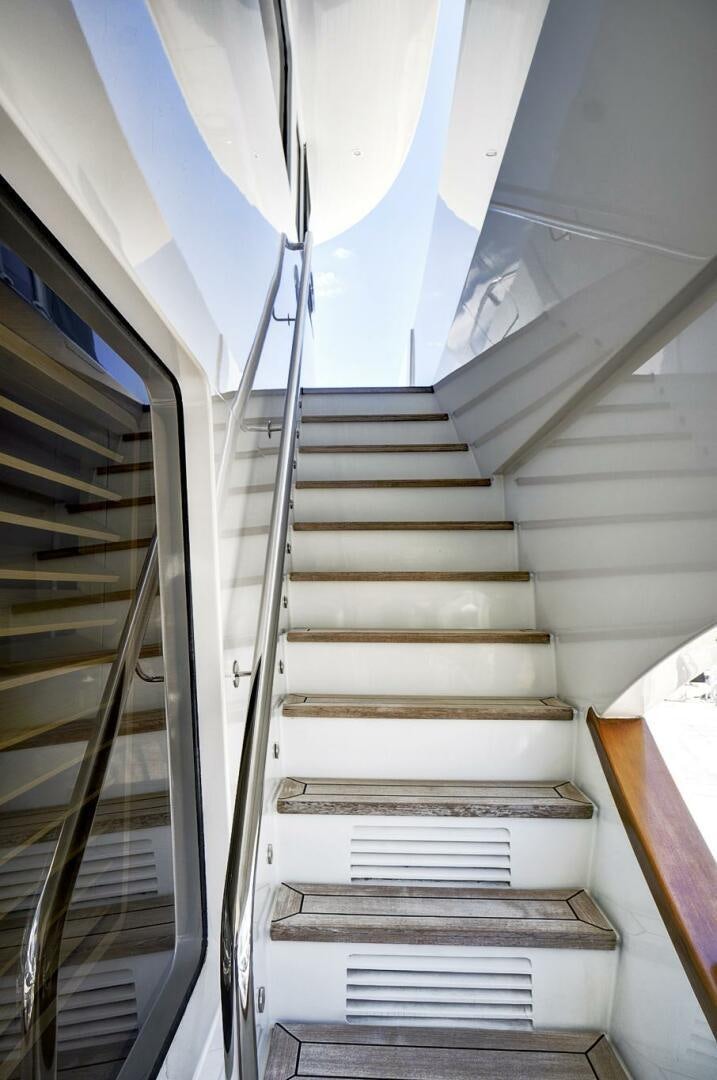a staircase with a light aboard SWEET CAROLINE Yacht for Sale