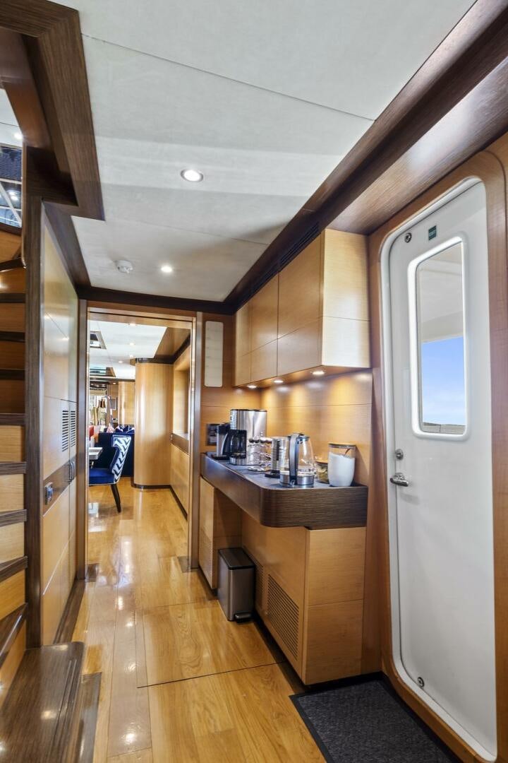 a kitchen with a counter and cabinets aboard SWEET CAROLINE Yacht for Sale