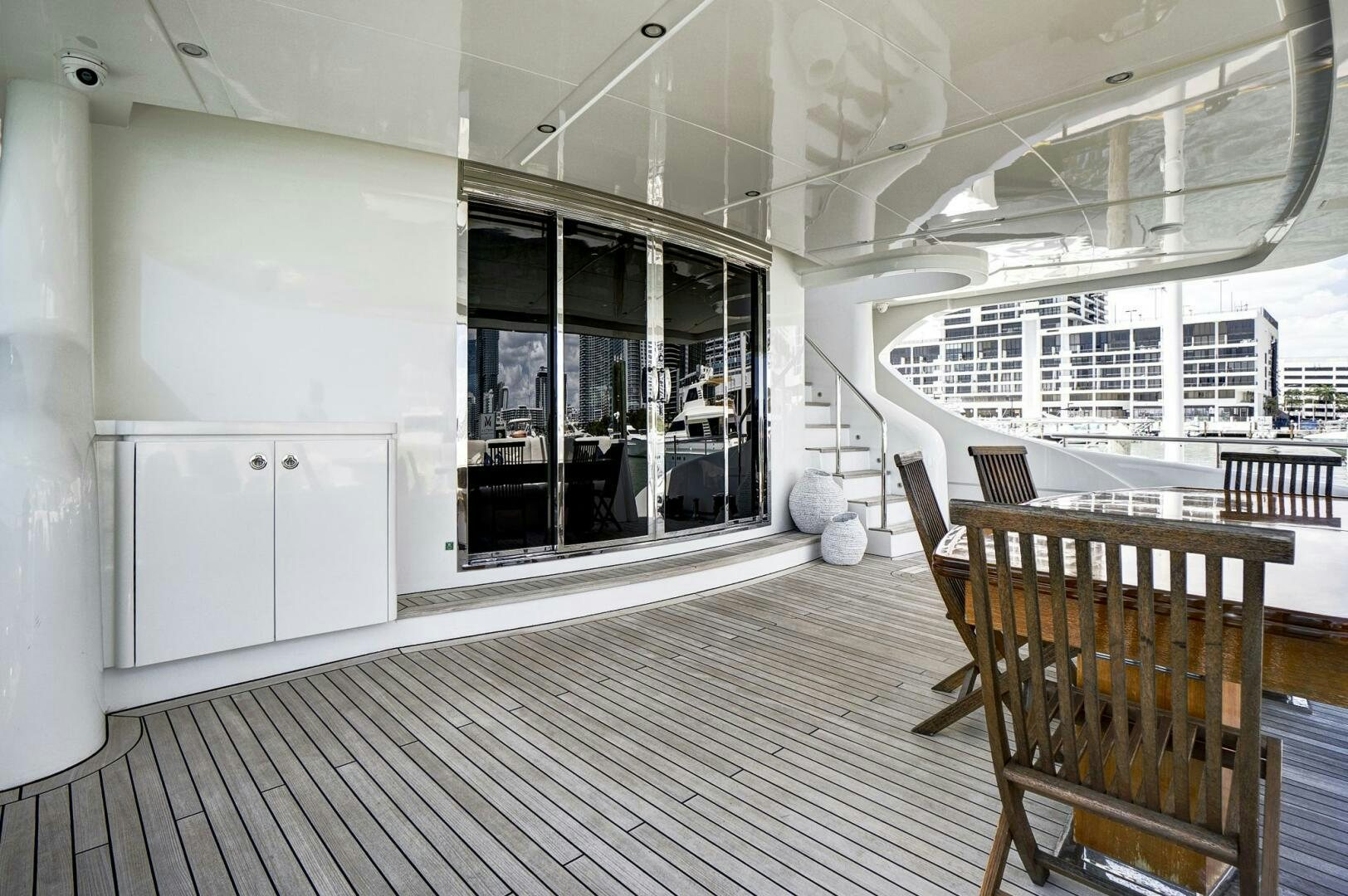 a room with a table and chairs aboard SWEET CAROLINE Yacht for Sale