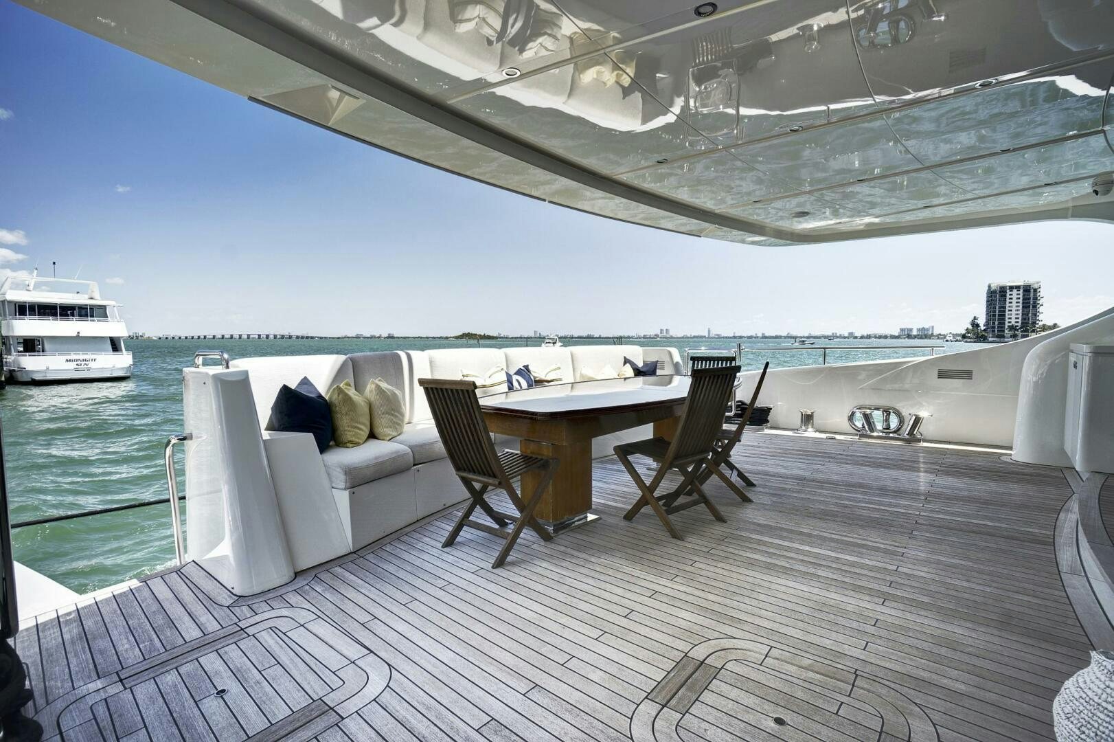 a table and chairs on a deck aboard SWEET CAROLINE Yacht for Sale