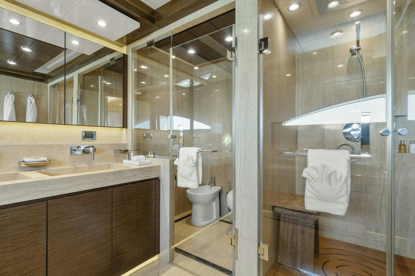 a bathroom with a glass shower aboard SWEET CAROLINE Yacht for Sale