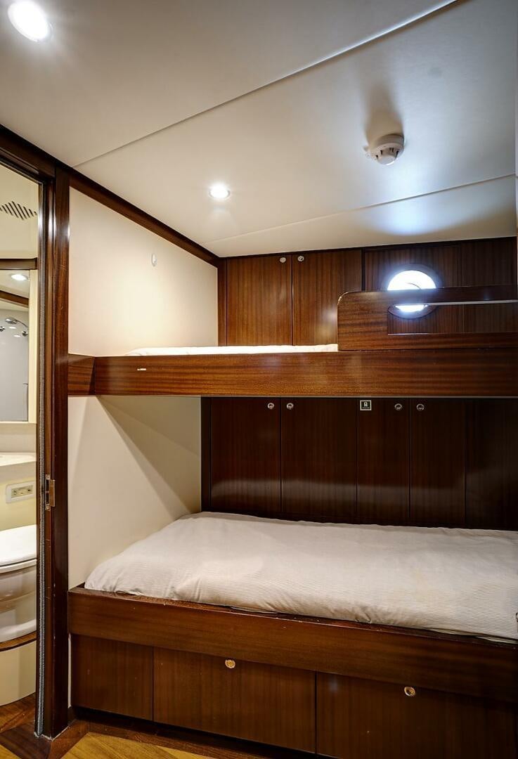 a bed in a room aboard SWEET CAROLINE Yacht for Sale