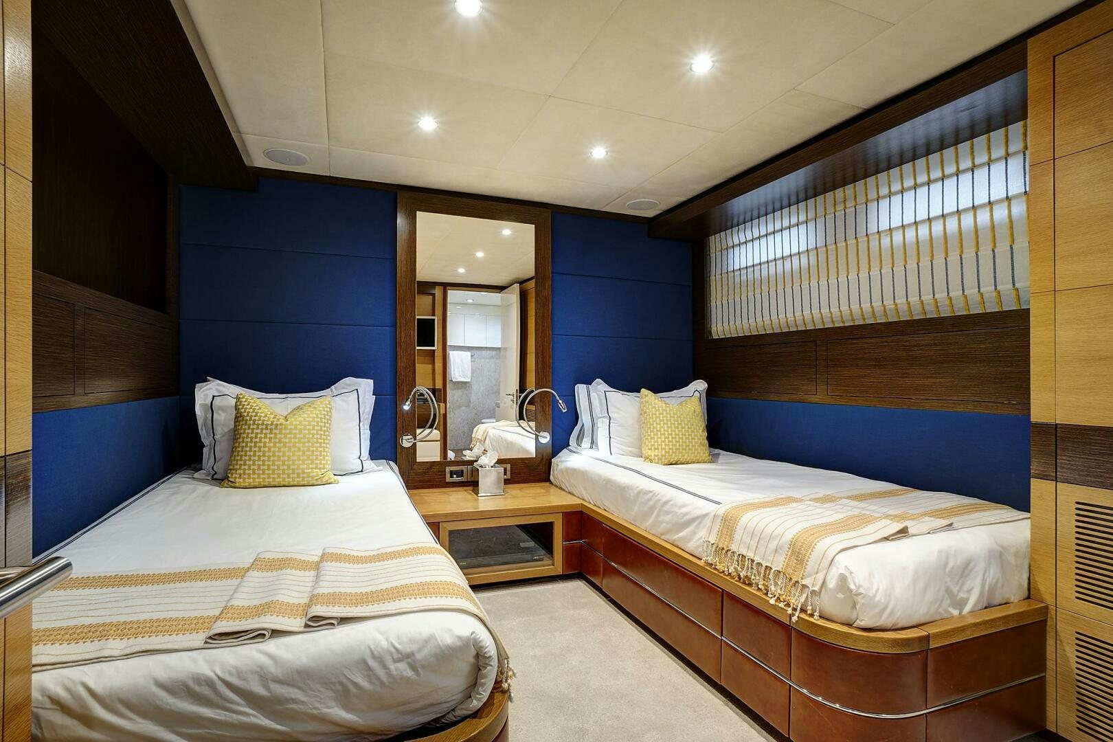 a room with a couple beds aboard SWEET CAROLINE Yacht for Sale