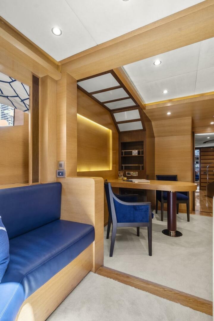 a room with a couch and a table aboard SWEET CAROLINE Yacht for Sale