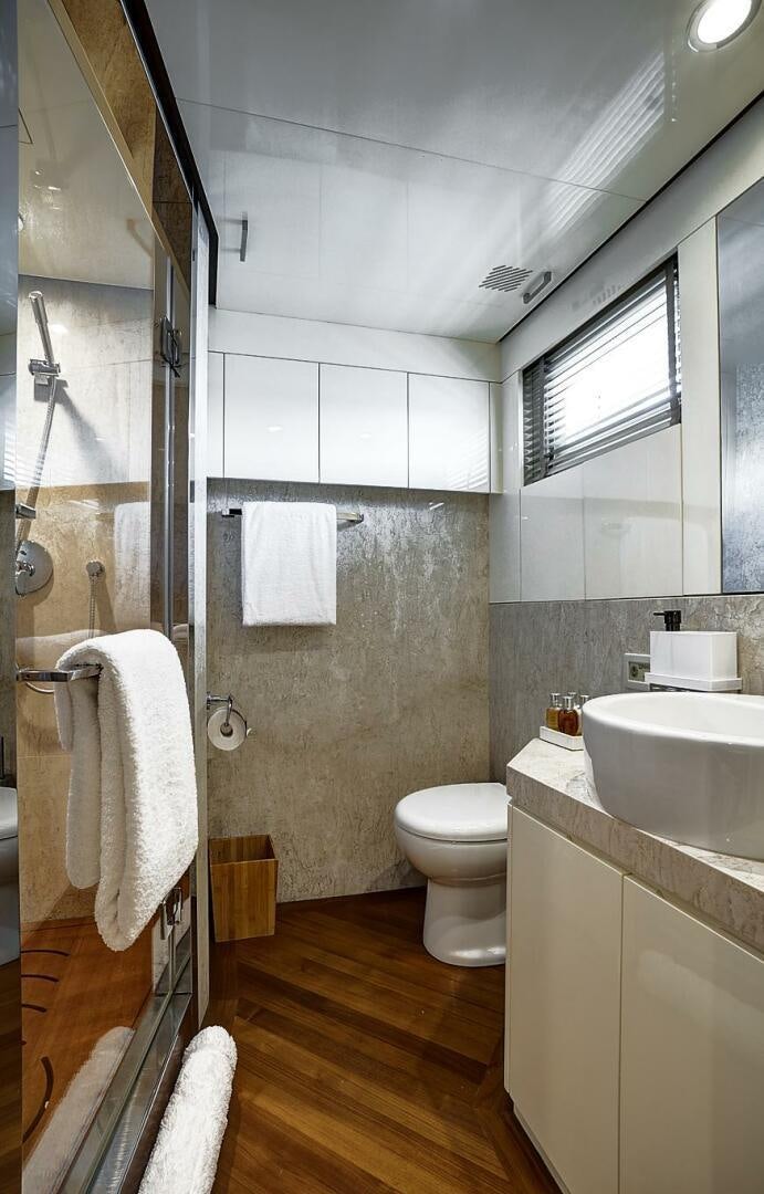 a bathroom with a sink toilet and shower aboard SWEET CAROLINE Yacht for Sale