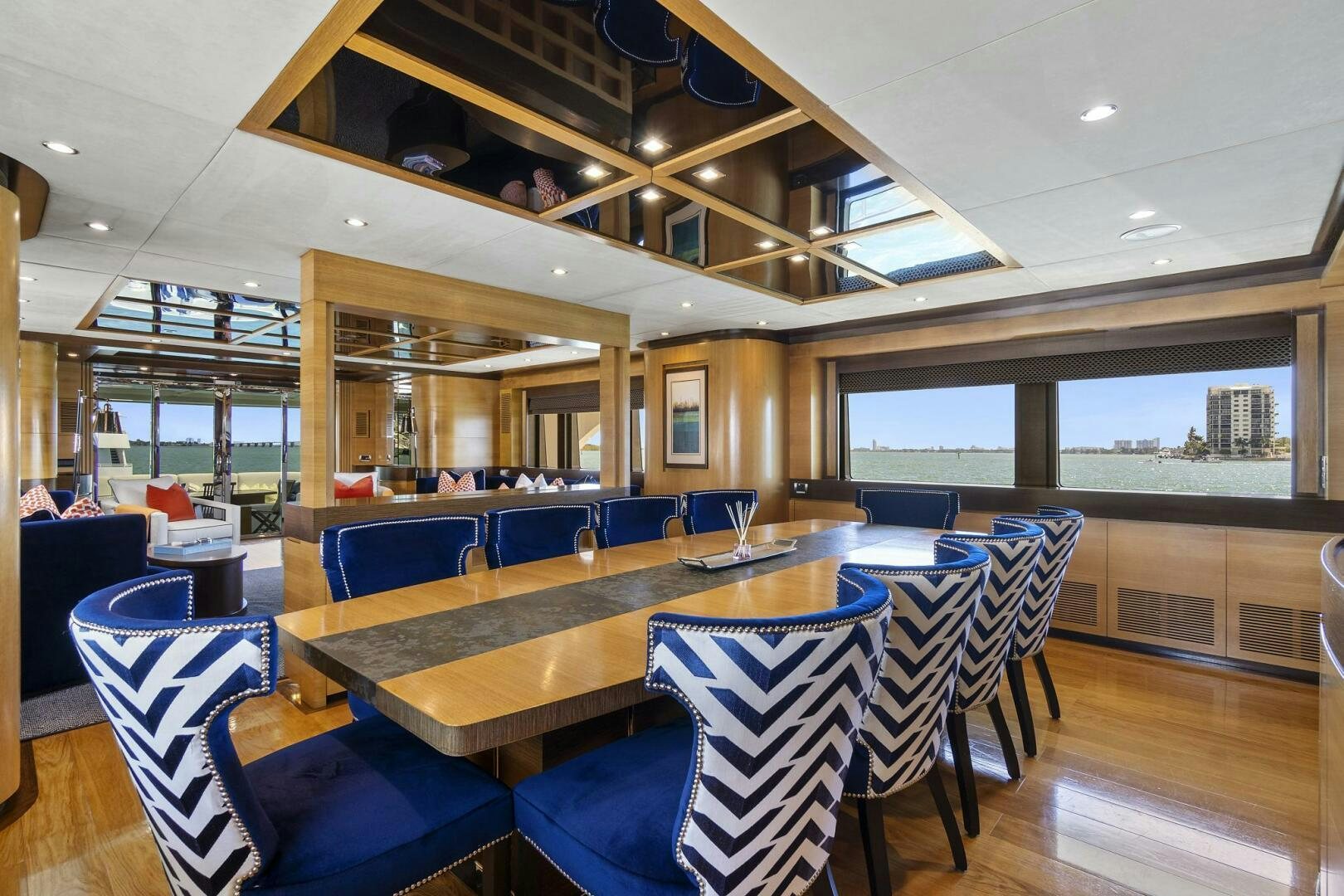 a large room with tables and chairs aboard SWEET CAROLINE Yacht for Sale