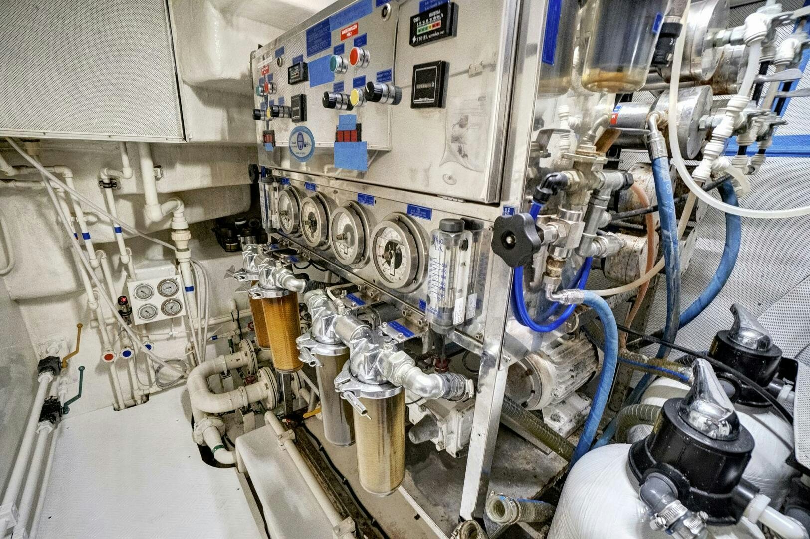 a large white machine with blue wires aboard SWEET CAROLINE Yacht for Sale