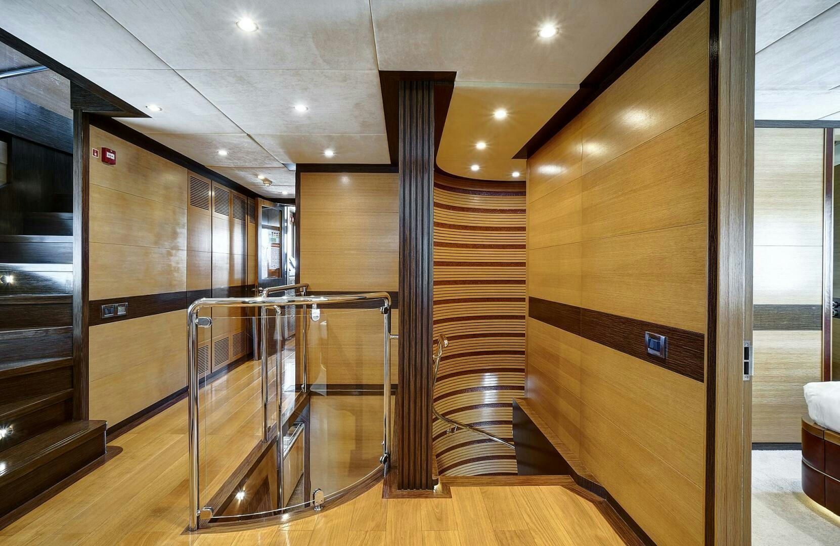 a room with wooden walls and a staircase aboard SWEET CAROLINE Yacht for Sale