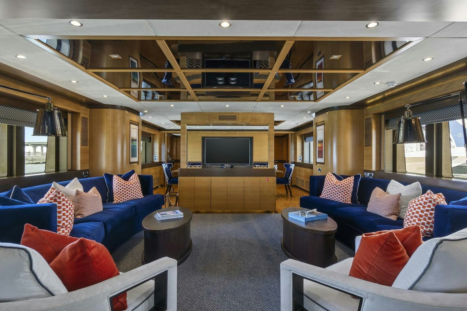 a living room with a couch and a fireplace aboard SWEET CAROLINE Yacht for Sale
