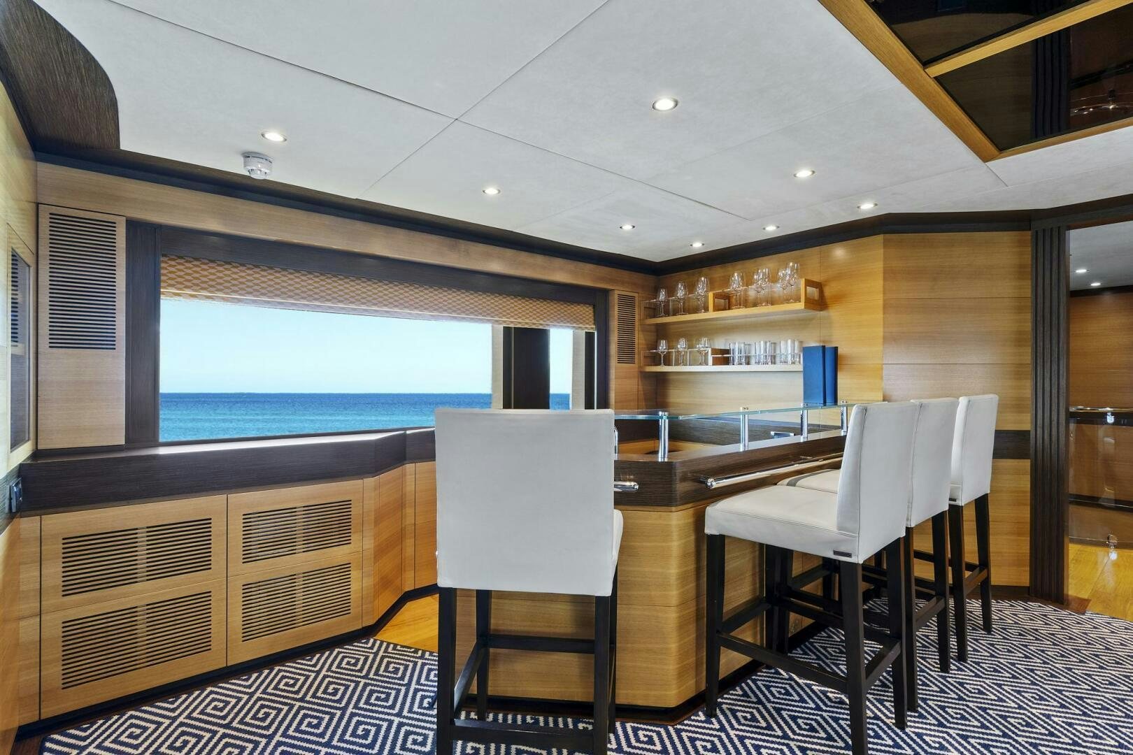 a room with a table and chairs aboard SWEET CAROLINE Yacht for Sale
