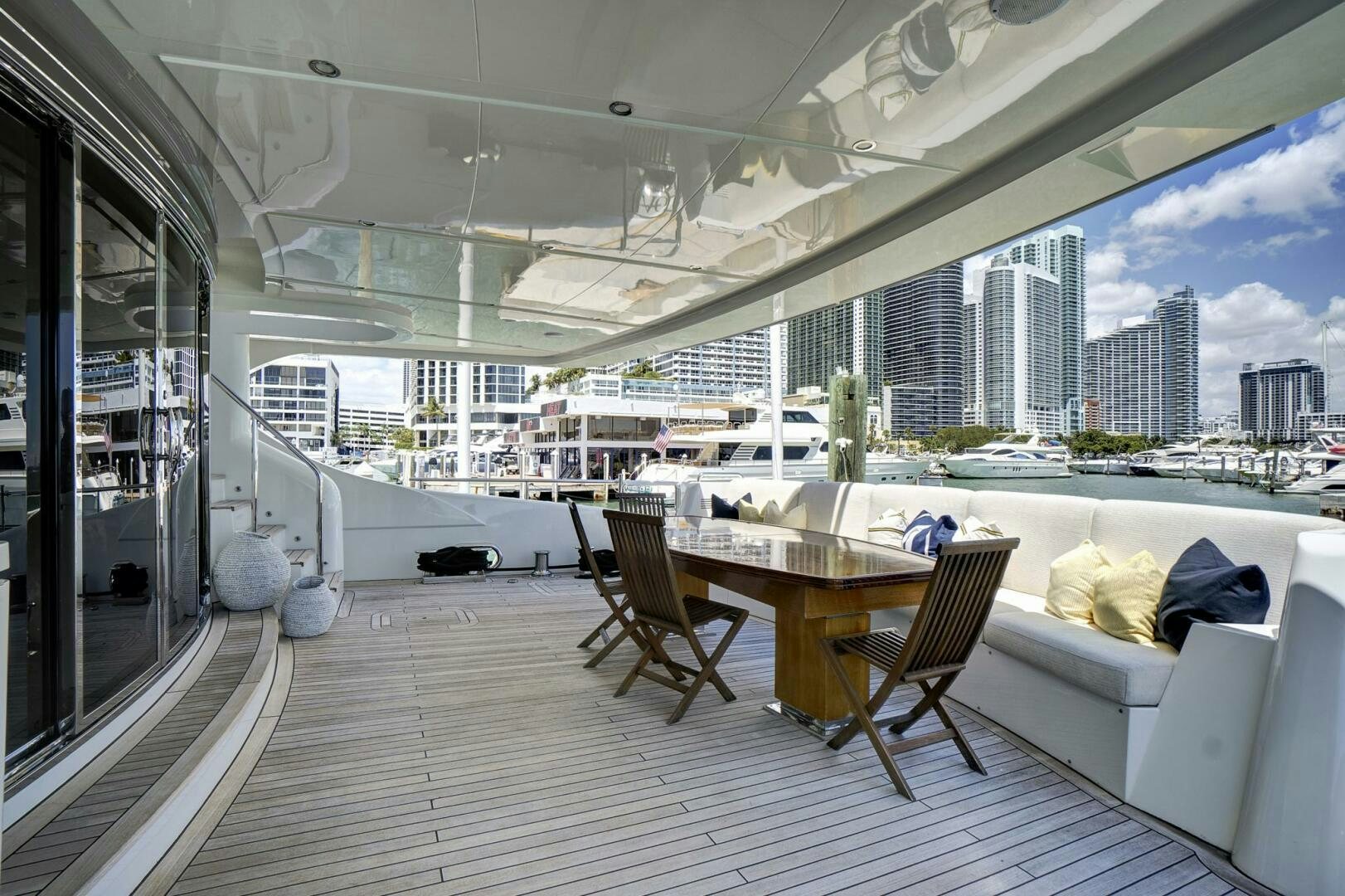 a room with a table and chairs aboard SWEET CAROLINE Yacht for Sale