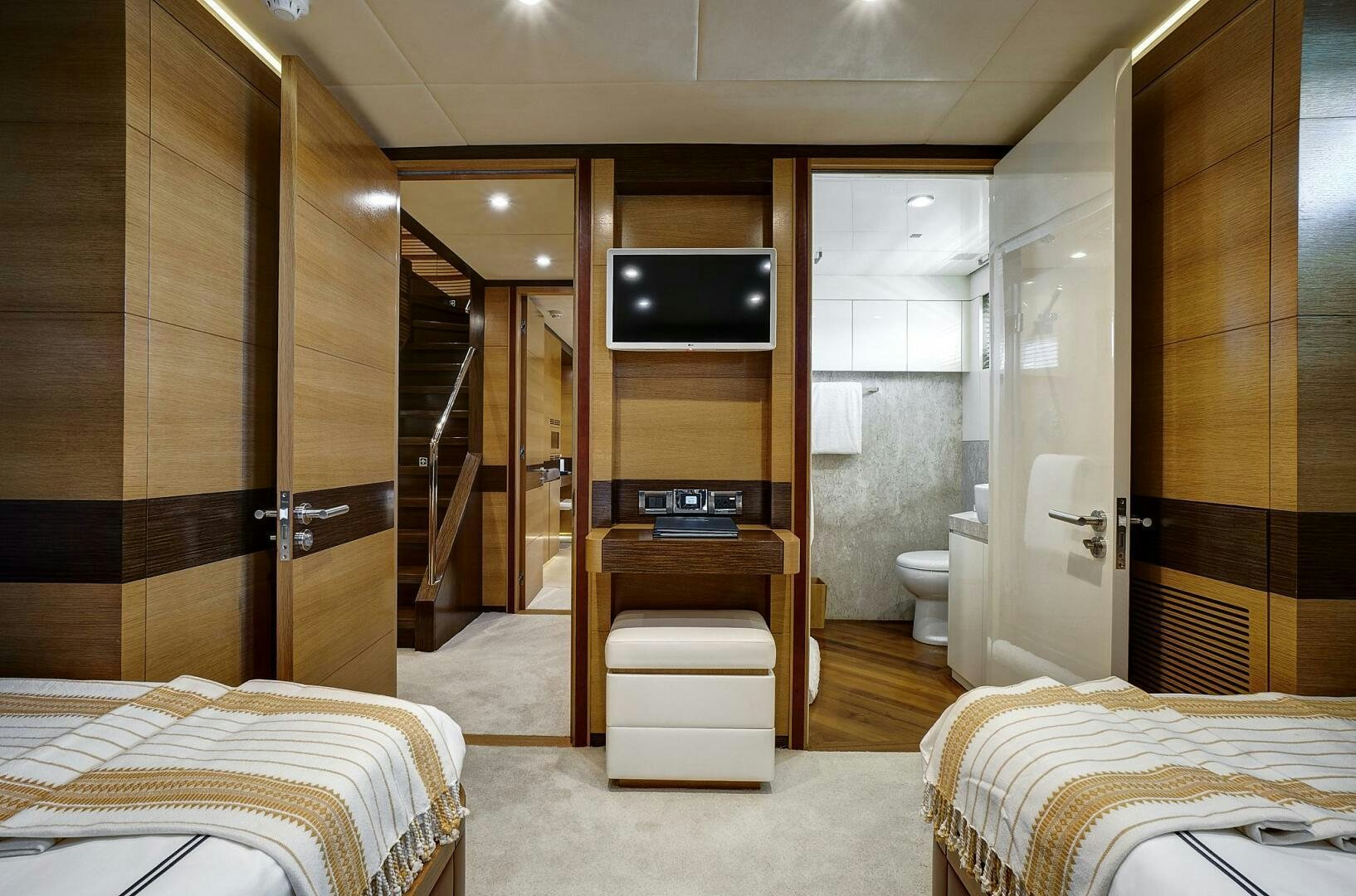 a room with a bed and a tv aboard SWEET CAROLINE Yacht for Sale