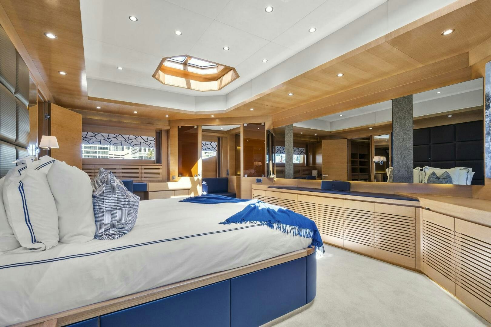 a room with beds and a large window aboard SWEET CAROLINE Yacht for Sale