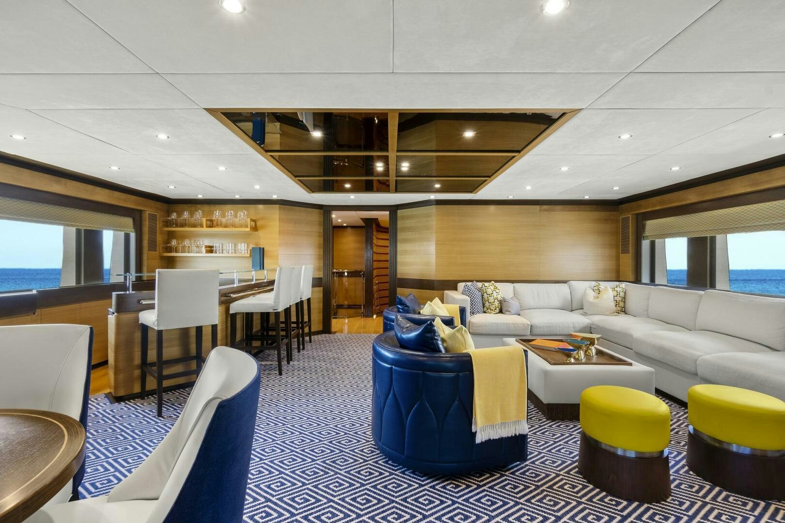 a room with a couch and chairs aboard SWEET CAROLINE Yacht for Sale