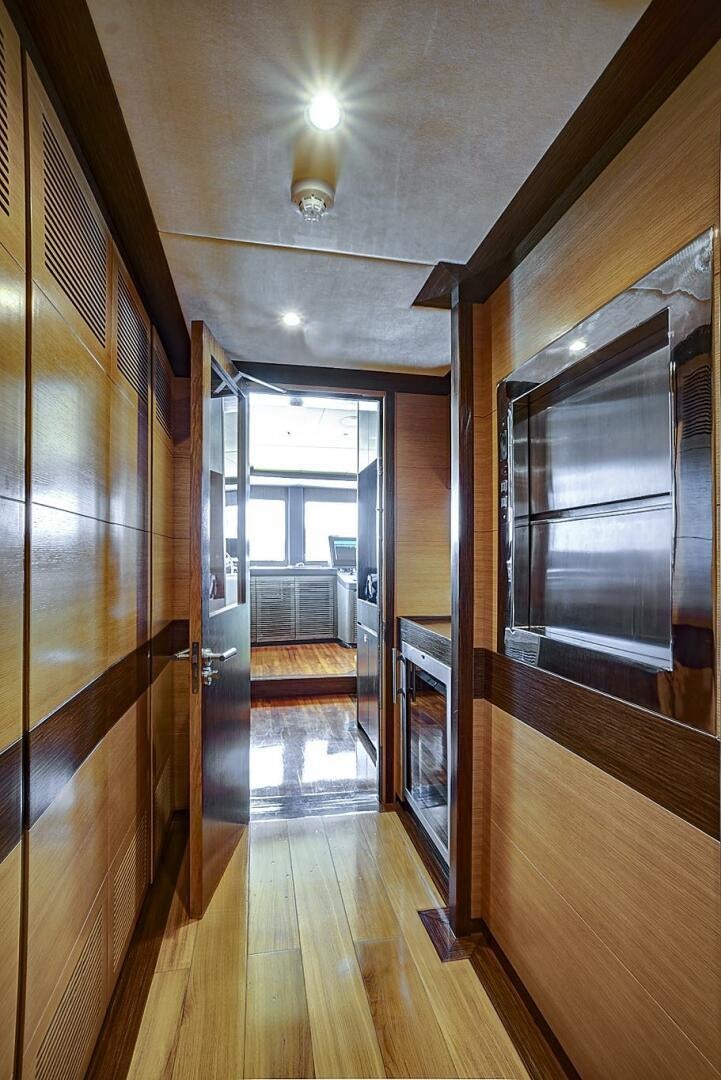 a wood room with a wood floor and a wood door aboard SWEET CAROLINE Yacht for Sale