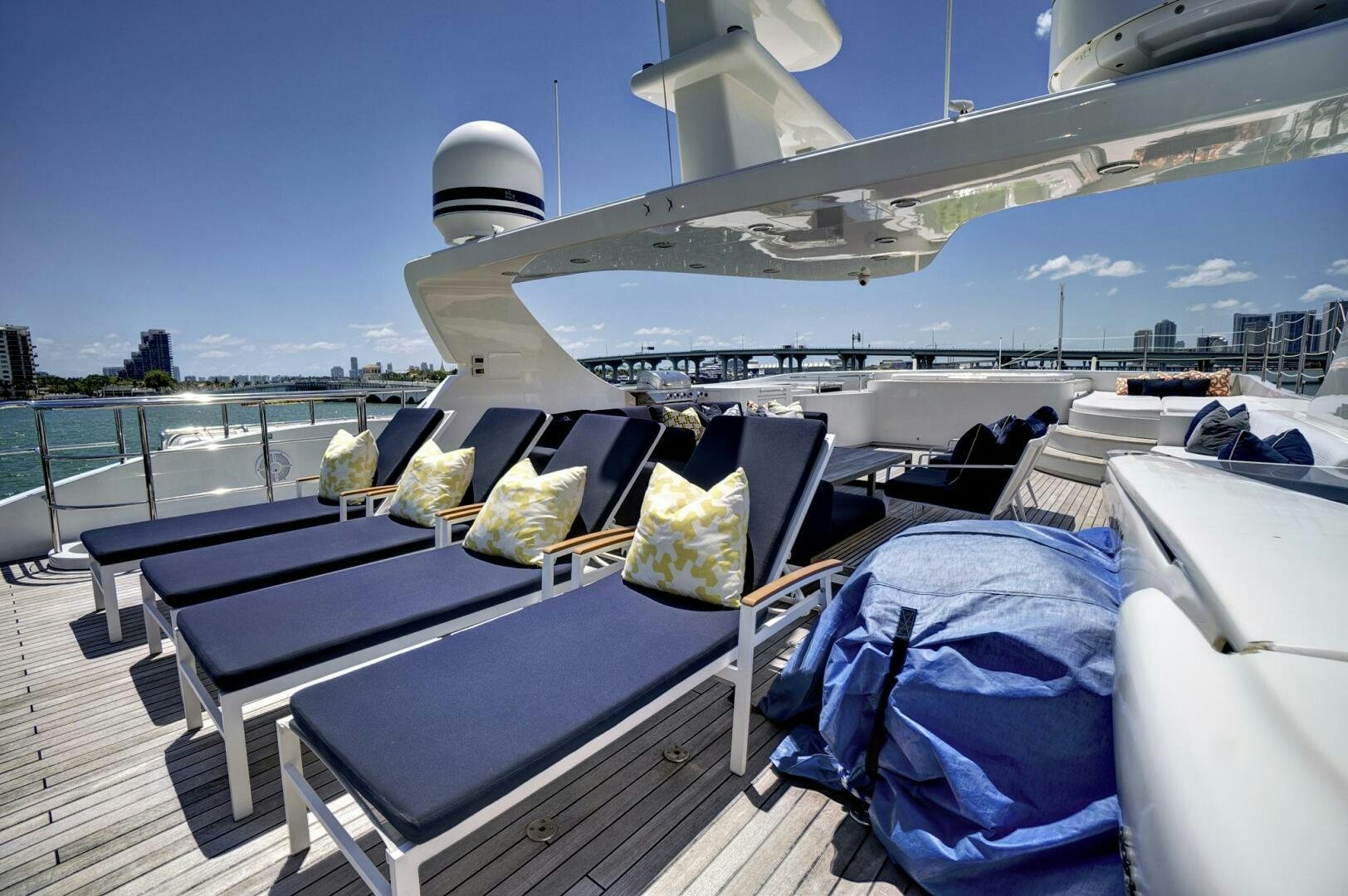a boat with a table and chairs on it aboard SWEET CAROLINE Yacht for Sale