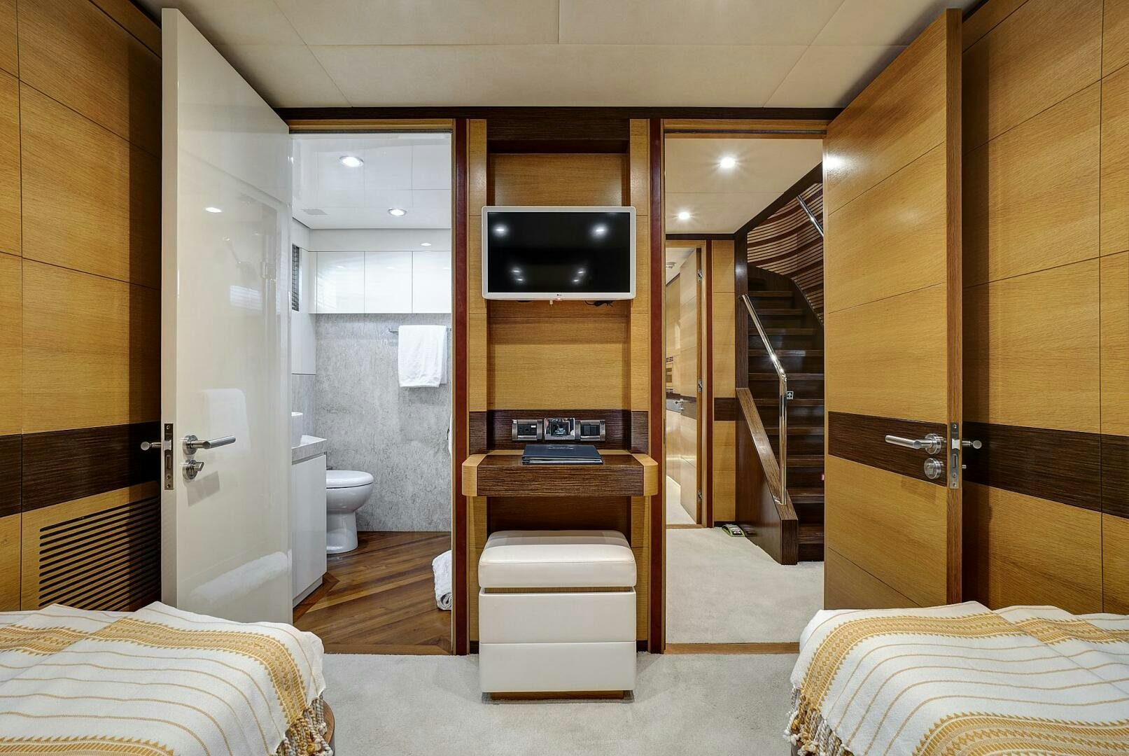 a room with a bed and a tv aboard SWEET CAROLINE Yacht for Sale