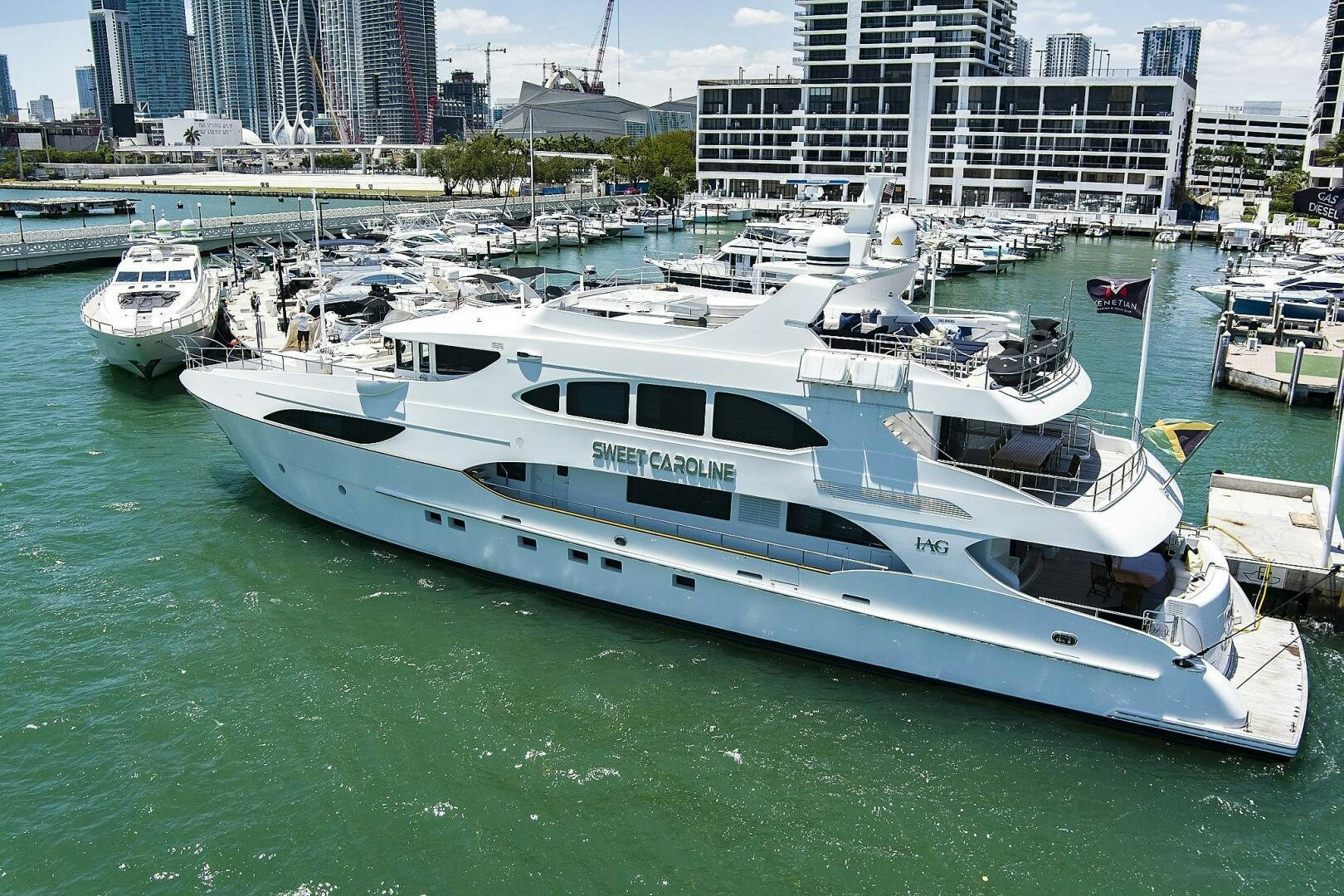 a large boat in a harbor aboard SWEET CAROLINE Yacht for Sale