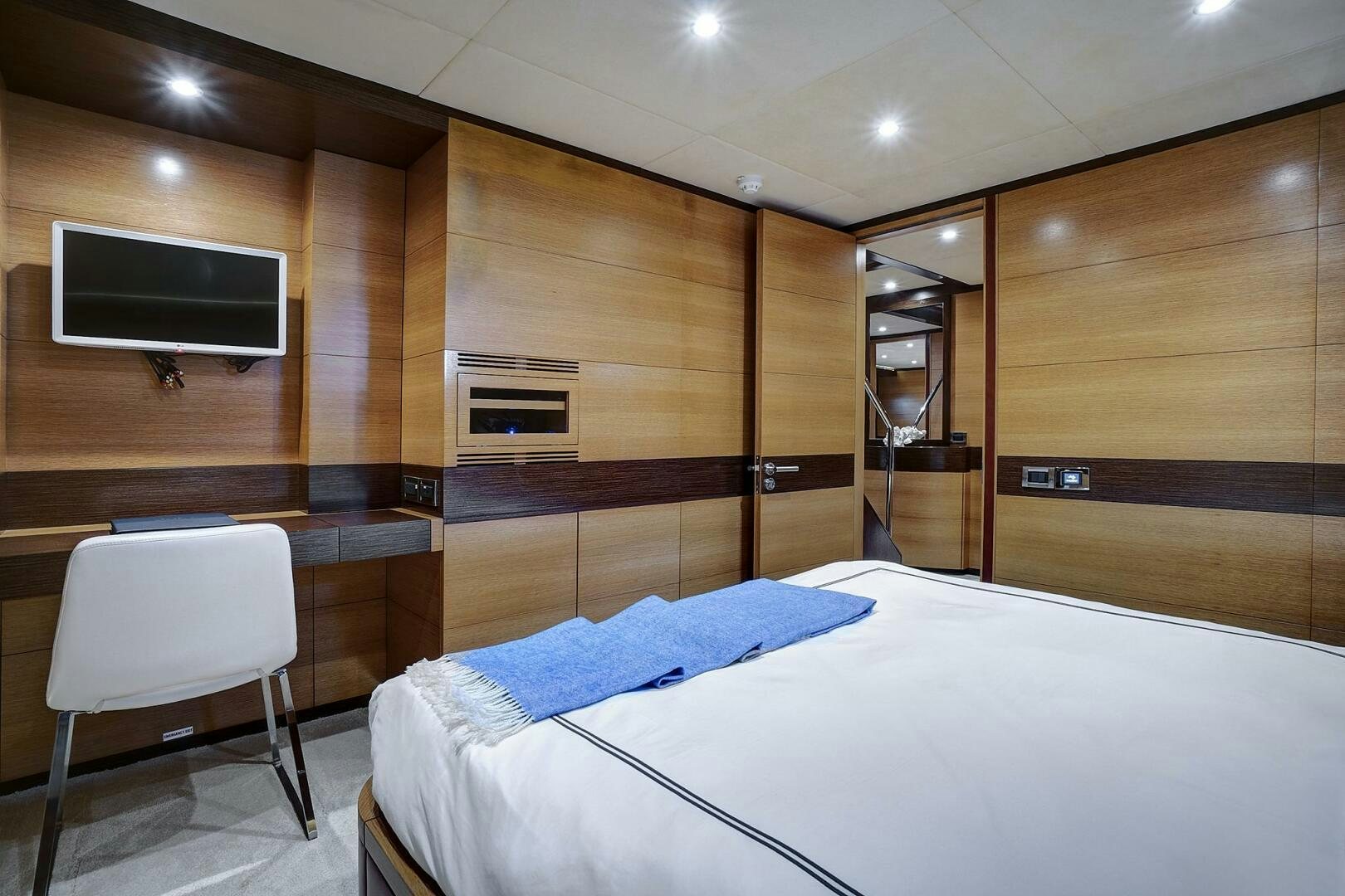 a room with a bed and a tv aboard SWEET CAROLINE Yacht for Sale